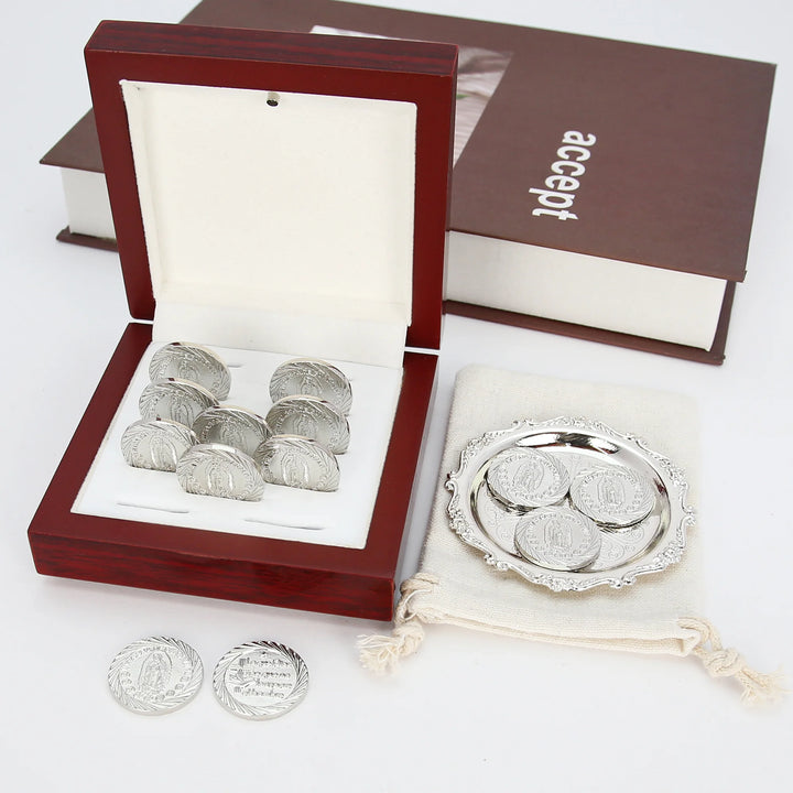 Traditional wedding arras set with 13 silver coins embossed with Our Lady of Guadalupe, paired with a decorative silver tray, fabric pouch, and wooden box. A meaningful Catholic ceremony accessory representing prosperity, love, and the sacred bond of marriage - tingkucoins.com