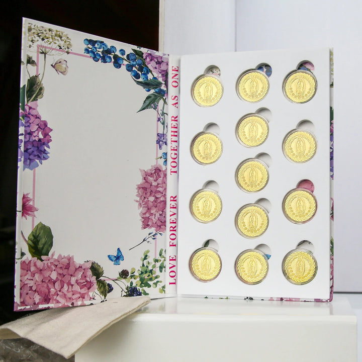 13 Gold Arras Coins with Virgin of Guadalupe design, presented in a decorative floral box. Ideal for Catholic weddings, Christian unity ceremonies, religious marriage traditions, and meaningful gifts that symbolize love, prosperity, and lifelong union - tingkucoins.com