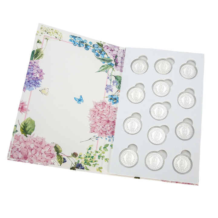 13 Silver Arras Coins with Virgin of Guadalupe design, beautifully packaged in a floral gift box. Perfect for Catholic weddings, Christian marriage traditions, symbolic unity ceremonies, and keepsake gifts for couples celebrating lifelong love - tingkucoins.com