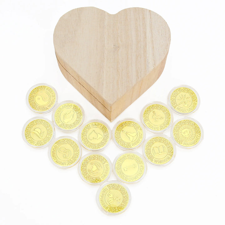 Rustic heart-shaped wooden box filled with 13 gold-tone inspirational coins, each engraved with positive affirmations like Love, Peace, Trust, and Joy. Perfect for mindfulness gifts, teacher appreciation, meditation decor, wedding keepsakes, and meaningful collectibles - tingkucoins.com