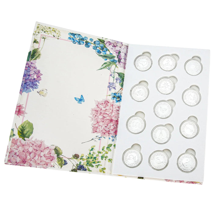 Elegant silver Spanish arras para boda católica: 13 coins symbolizing Amor, Unión, Paz, Respeto, and Sabiduría. Each coin carries blessings for marriage. Displayed in a floral presentation box, this unity coin set is ideal for Catholic/Christian wedding traditions and anniversary keepsakes - tingkucoins.com